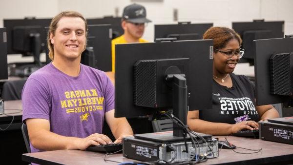 Student seated near computer